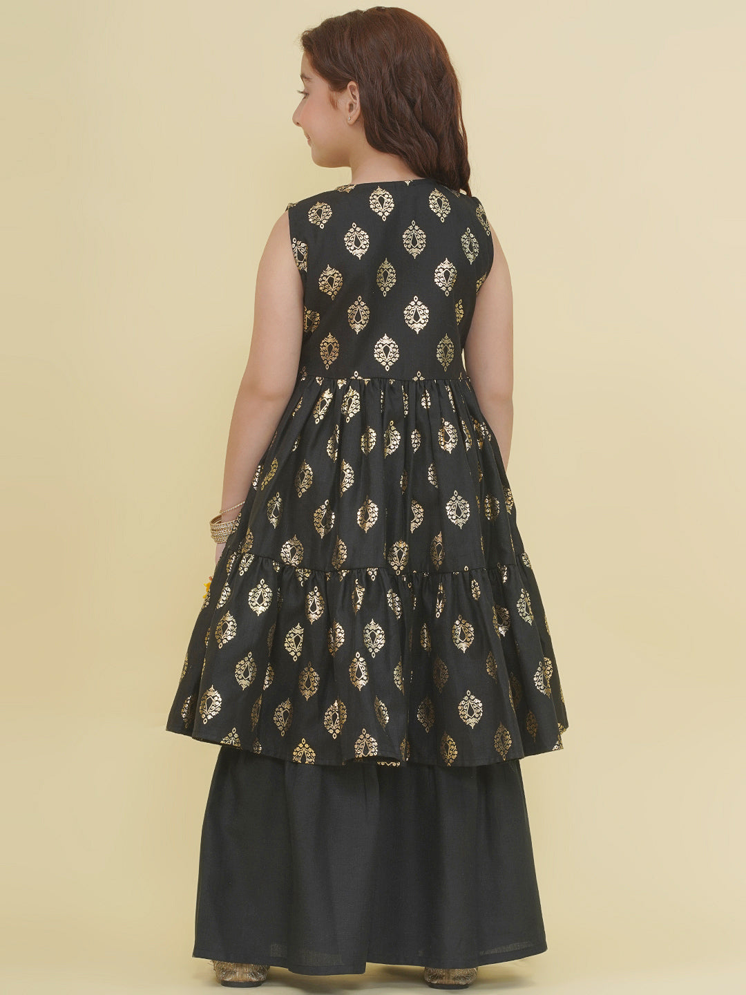 Bitiya by Bhama Girls Black foil Printed Angrakha Tiered Kurta with Sharara