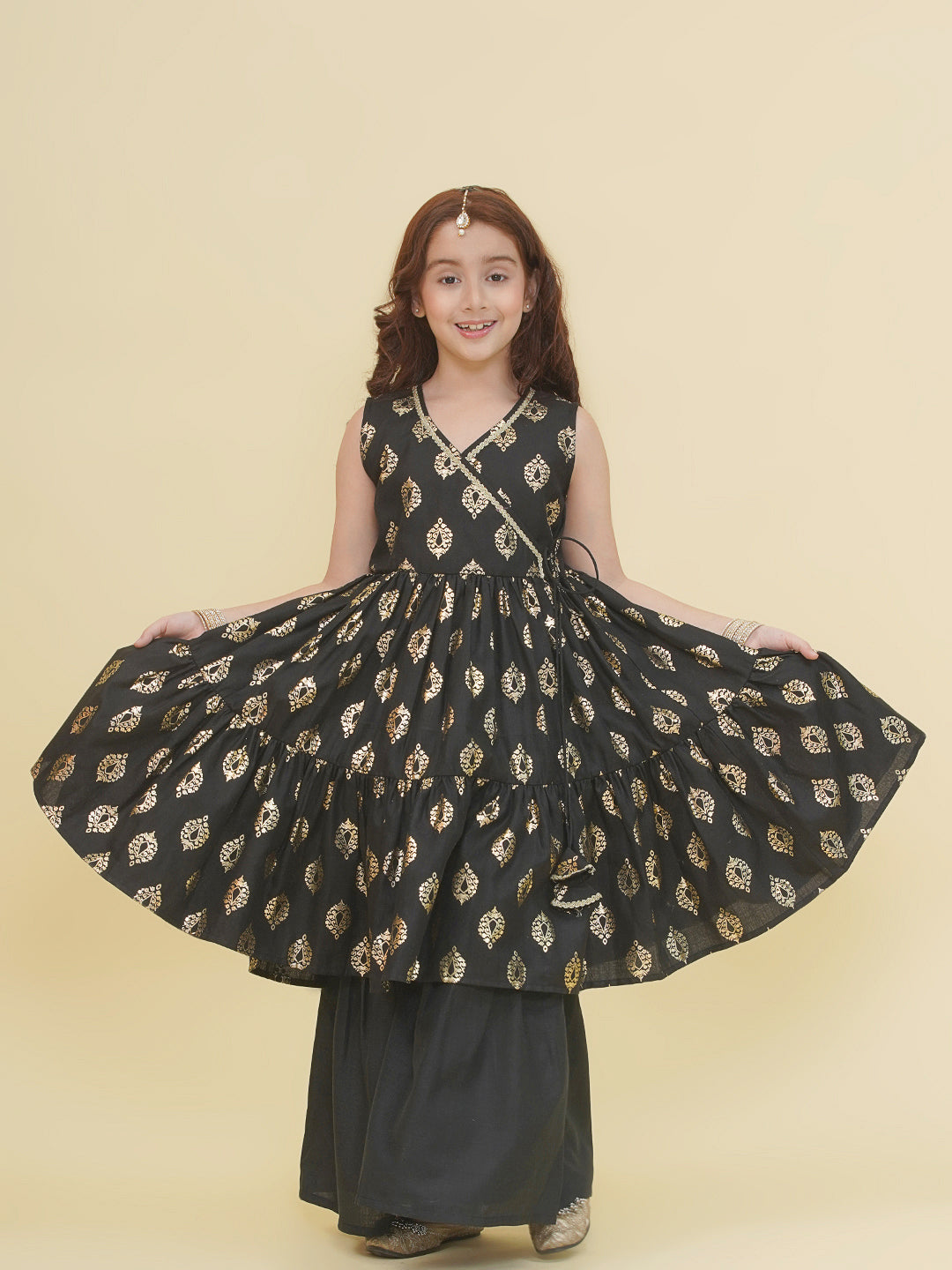 Bitiya by Bhama Girls Black foil Printed Angrakha Tiered Kurta with Sharara