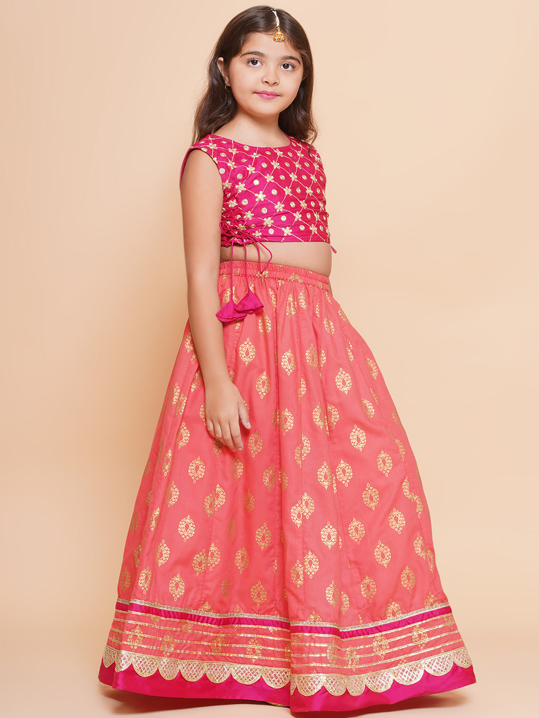 Bitiya by Bhama Girls Pink Embroidered Choli & Peach Golden print Ready to Wear Lehenga With Dupatta