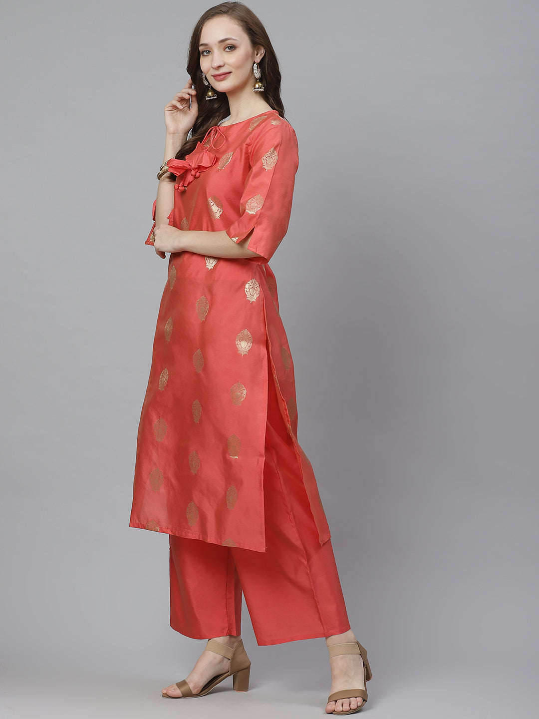 Coral pink and golden woven design kurta with palazzos