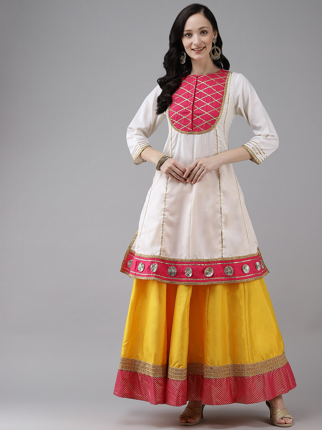 White gotta lace kurta with Yellow solid skirt.