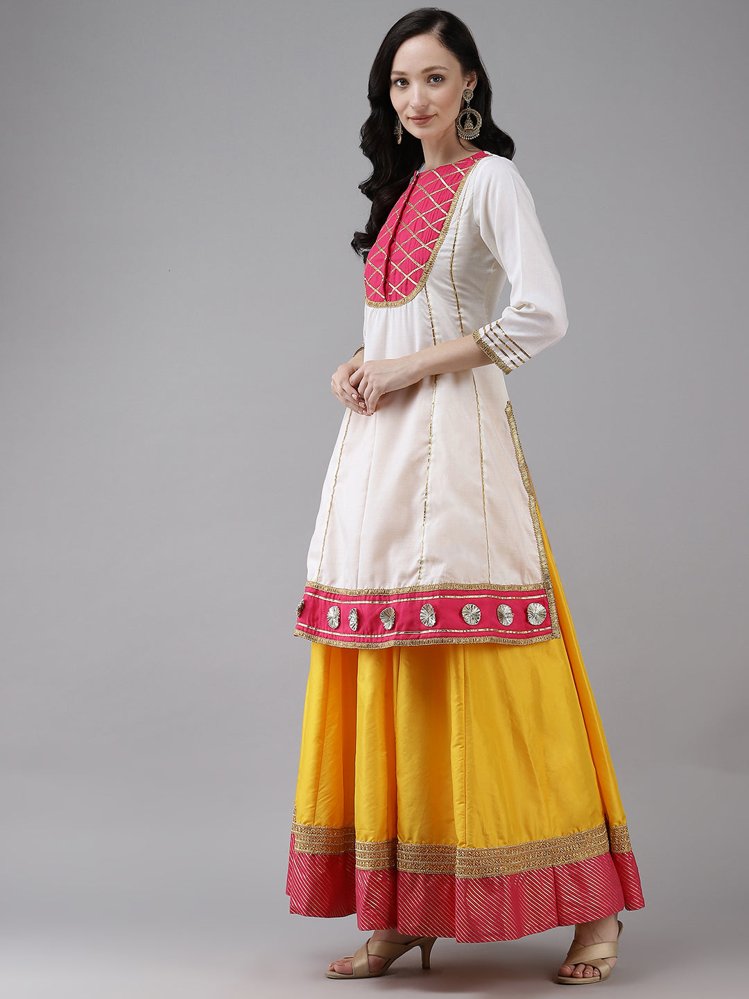 White gotta lace kurta with Yellow solid skirt.