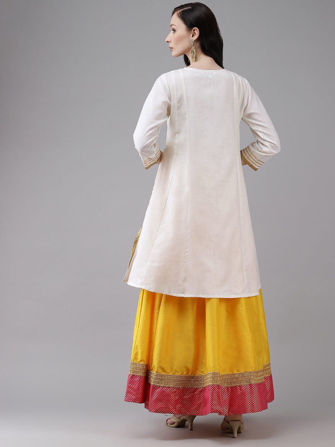 White gotta lace kurta with Yellow solid skirt.